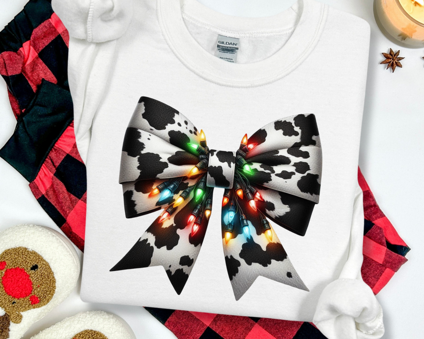 šCow Print Bow with Christmas Lights Sweatshirtš