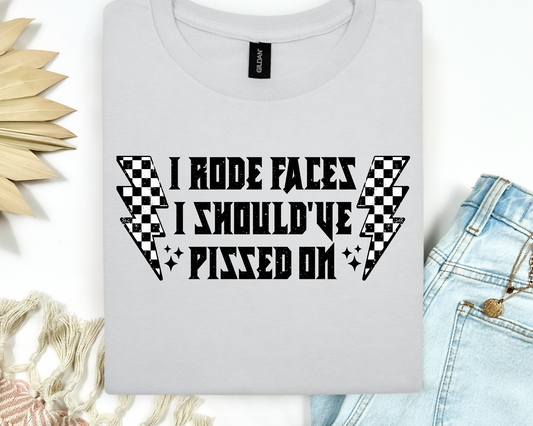 "I Rode Faces I Should've Pissed On" Graphic Tee – Checkered Lightning Bolt Design